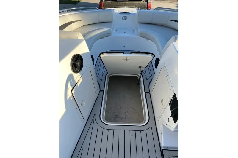 Slide: The Image of 2020 Hurricane SunDeck Sport 188 IO boat interior with open storage compartment. - 12