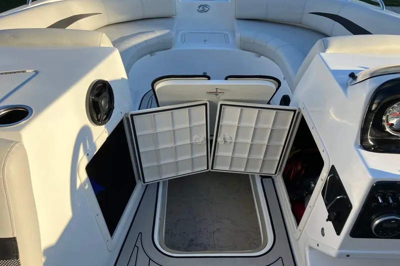 Slide: The Image of 2020 Hurricane SunDeck Sport 188 IO boat interior with open storage compartments. - 14