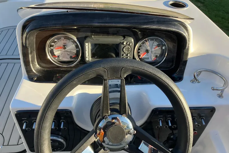 Slide: The Image of Steering console of 2020 Hurricane SunDeck Sport 188 IO boat with gauges and controls. - 8