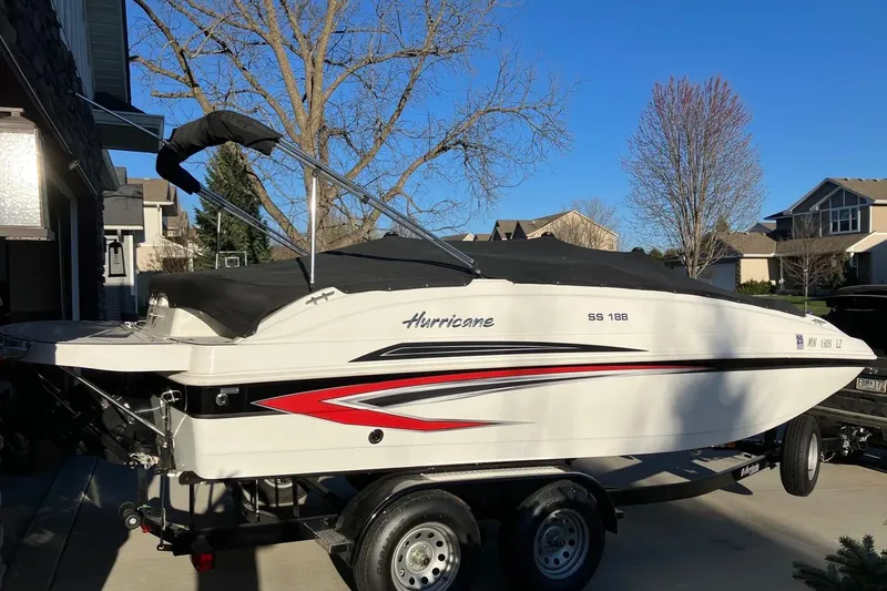 Slide: The Image of 2020 Hurricane SunDeck Sport 188 IO boat on trailer in suburban driveway. - 4