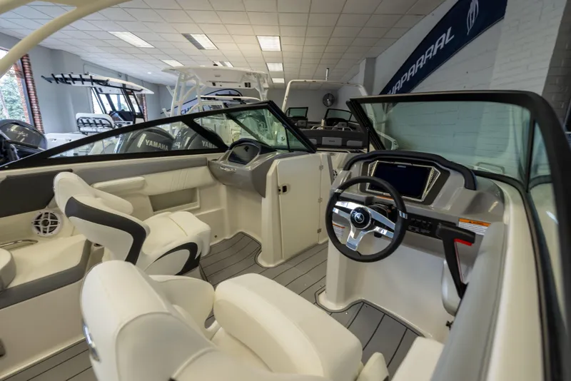 Slide: The Image of Interior view of 2026 Chaparral 23 SSi OB boat with modern dashboard and seating. - 21