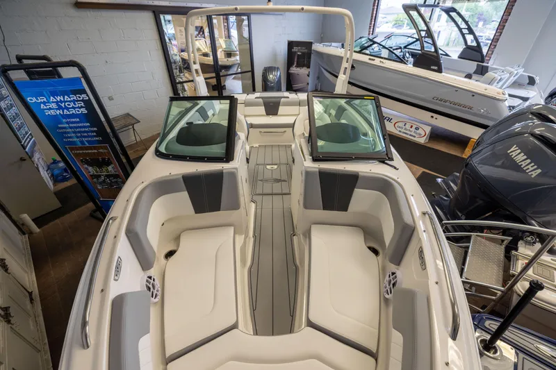 Slide: The Image of 2026 Chaparral 23 SSi OB boat interior with seating and Yamaha outboard motor. - 5
