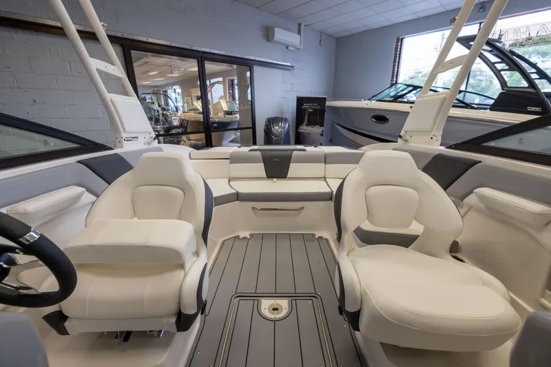 Slide: The Image of 2026 Chaparral 23 SSi OB boat interior with modern seating and sleek design. - 12