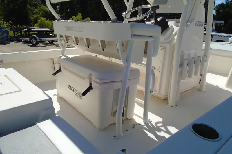 Slide: The Image of 2022 Pathfinder 2200 TRS boat interior with seating and storage compartments. - 9