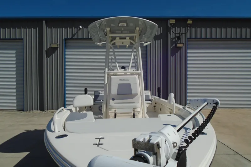 Slide: The Image of 2022 Pathfinder 2200 TRS boat in front of industrial garage doors. - 3