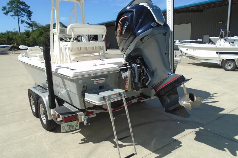 Slide: The Image of 2022 Pathfinder 2200 TRS boat with Yamaha outboard motor on trailer in sunny marina. - 12