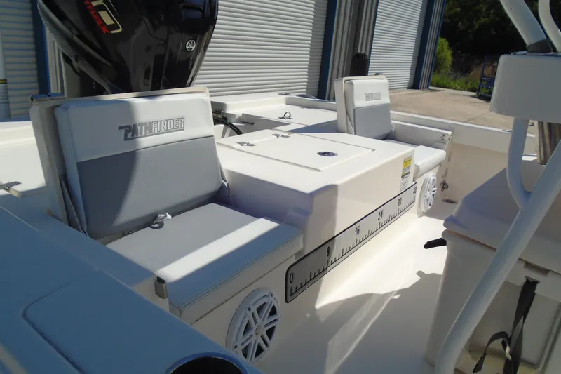 Slide: The Image of 2022 Pathfinder 2200 TRS boat interior with seating and storage compartments. - 10