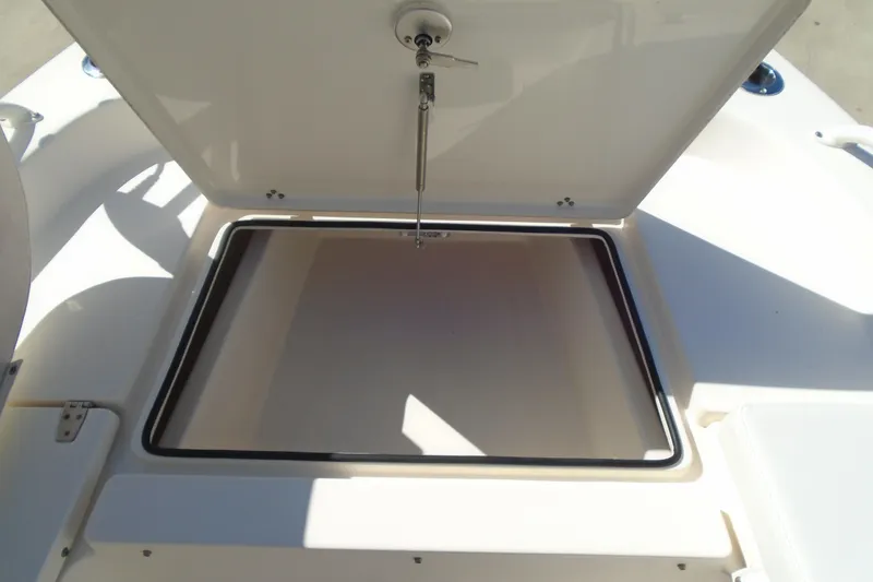 Slide: The Image of Open storage compartment on 2022 Pathfinder 2200 TRS boat, showcasing spacious interior. - 29