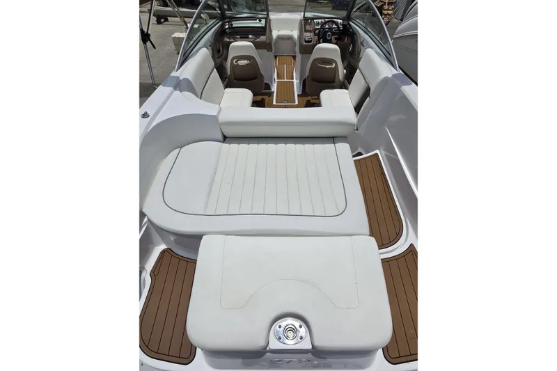 Slide: The Image of 2006 Cobalt 272 boat interior with white seating and wood accents. - 6