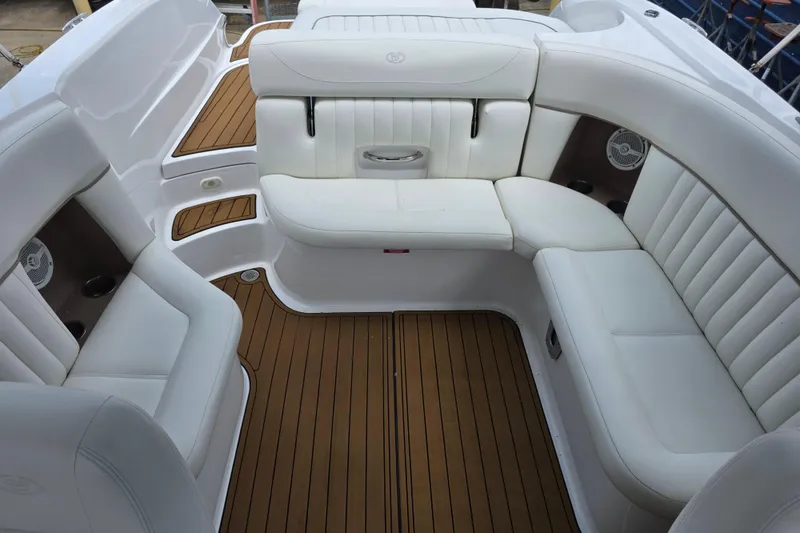 Slide: The Image of Luxurious white seating on a 2006 Cobalt 272 boat with teak flooring. - 22