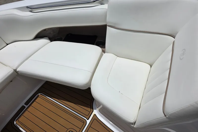 Slide: The Image of White leather seating on a 2006 Cobalt 272 boat with teak flooring. - 17