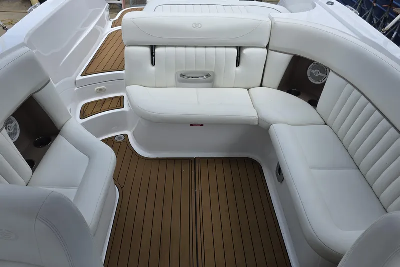 Slide: The Image of Luxurious interior of a 2006 Cobalt 272 boat with white seating and teak flooring. - 21