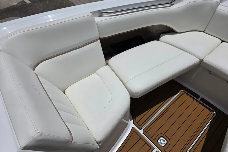 Slide: The Image of 2006 Cobalt 272 boat interior with white leather seating and teak-style flooring. - 18