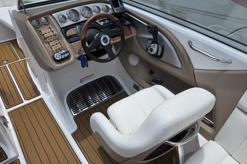 Slide: The Image of Interior of a 2006 Cobalt 272 boat showing steering wheel and control panel. - 12