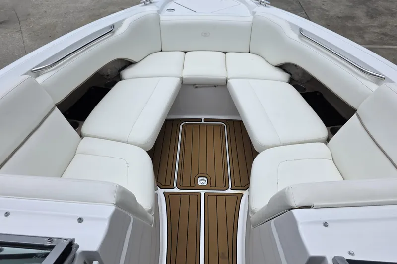 Slide: The Image of Luxurious seating area on a 2006 Cobalt 272 boat with white cushions and teak flooring. - 15