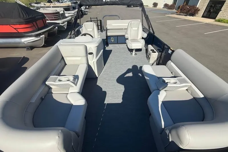 Slide: The Image of 2027 Godfrey EX 2286 SFLX pontoon boat with spacious seating and modern design. - 4