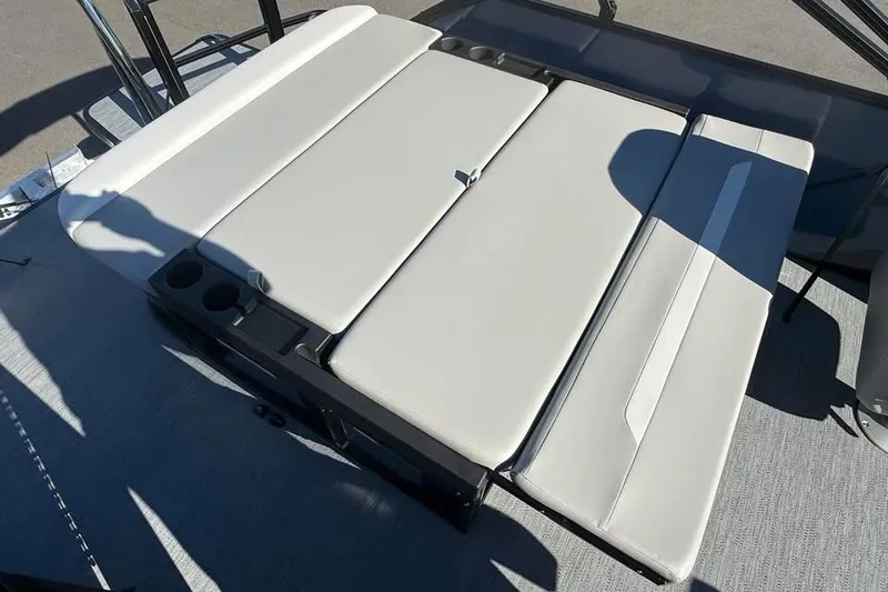 Slide: The Image of Luxurious seating on 2027 Godfrey EX 2286 SFLX pontoon boat, featuring cup holders and sleek design. - 12