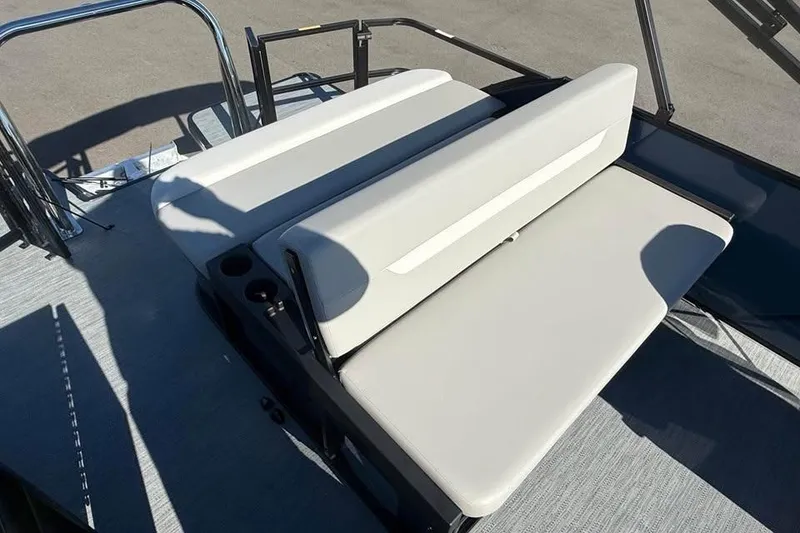 Slide: The Image of 2027 Godfrey EX 2286 SFLX boat with sleek seating and cup holders on deck. - 11