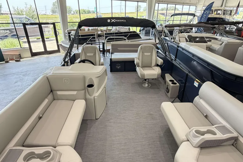 Slide: The Image of Luxurious 2027 Godfrey EX 2286 SFLX pontoon boat interior with plush seating and modern design. - 5