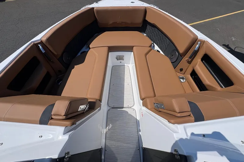 Slide: The Image of Luxurious seating area of 2026 Four Winns H6 boat with tan upholstery. - 15