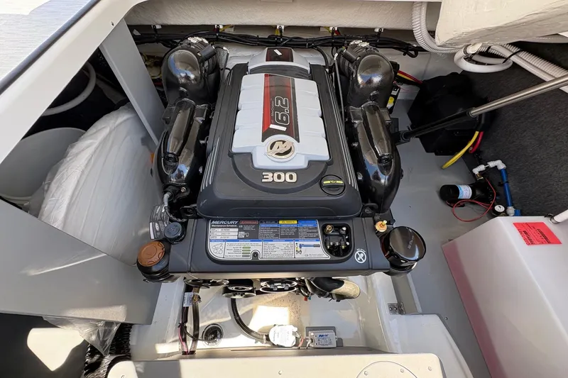 Slide: The Image of Engine compartment of 2026 Four Winns H6 boat, featuring a powerful Mercury 6.2L engine. - 18
