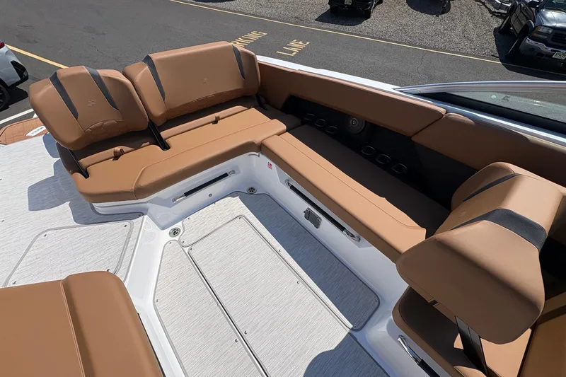 Slide: The Image of Luxurious seating area on the 2026 Four Winns H6 boat, featuring tan upholstery. - 10