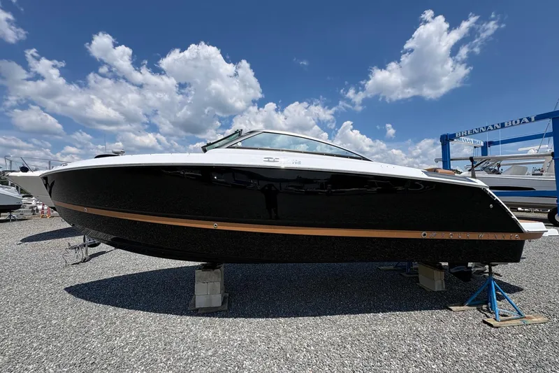 Slide: The Image of 2026 Four Winns H6 boat displayed outdoors on a sunny day. - 3