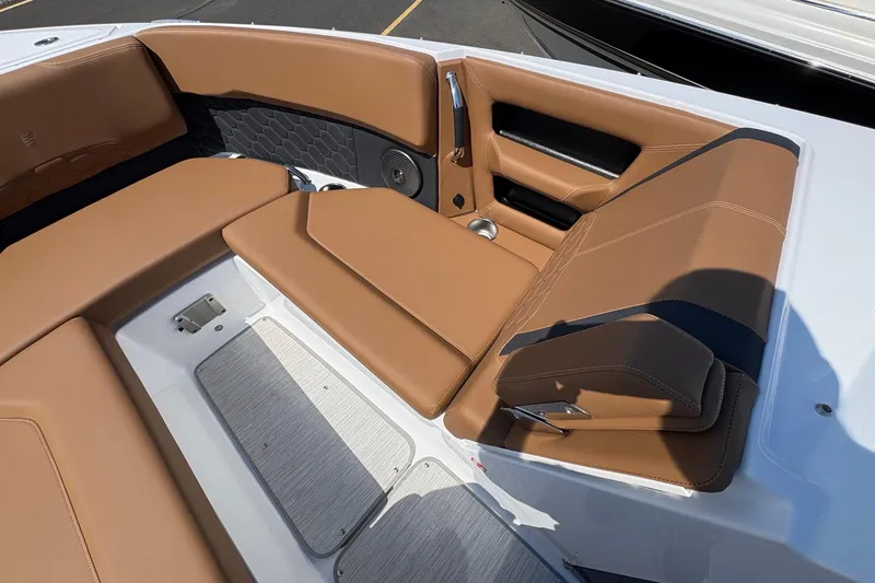 Slide: The Image of Luxurious seating area on 2026 Four Winns H6 boat with tan upholstery. - 16