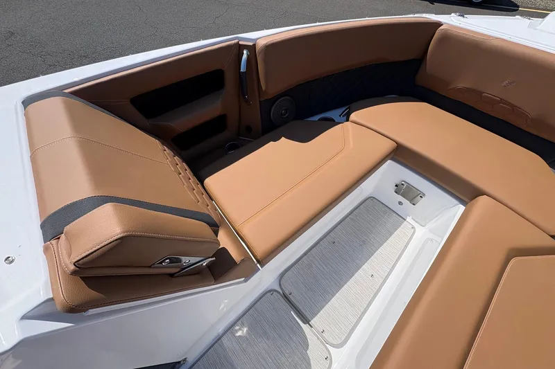 Slide: The Image of Luxurious tan seating in 2026 Four Winns H6 boat, showcasing premium interior design. - 17