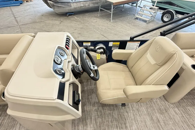Slide: The Image of Captain's seat and helm of 2027 Godfrey EX 2286 SBX pontoon boat. - 7