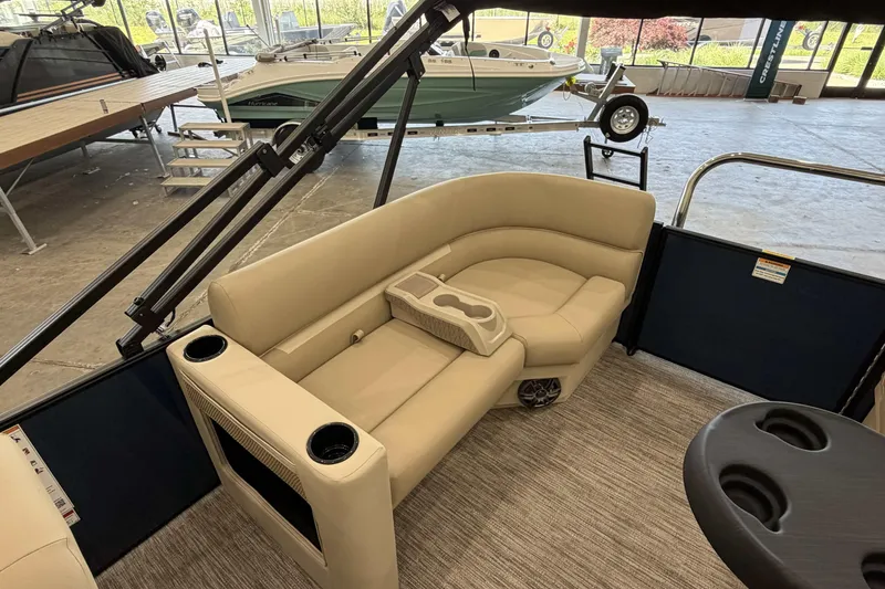 Slide: The Image of Luxurious seating on 2027 Godfrey EX 2286 SBX pontoon boat, featuring cup holders and modern design. - 8