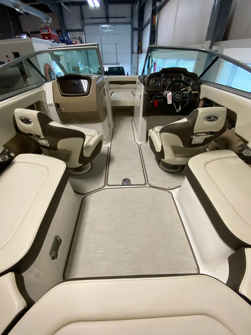 Slide: The Image of Interior view of a Chaparral 24 SSI boat with beige and brown seating. - 5
