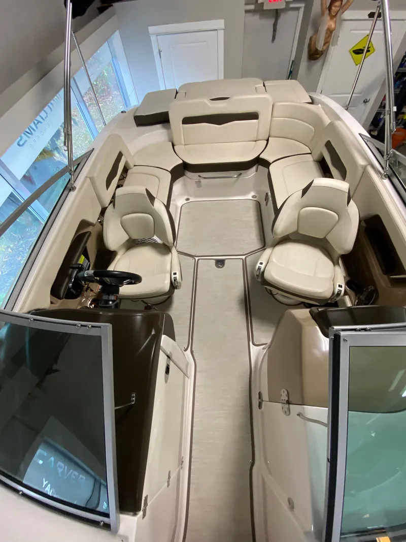 Slide: The Image of Interior view of a Chaparral 24 SSI boat with beige seating and an open cockpit. - 15
