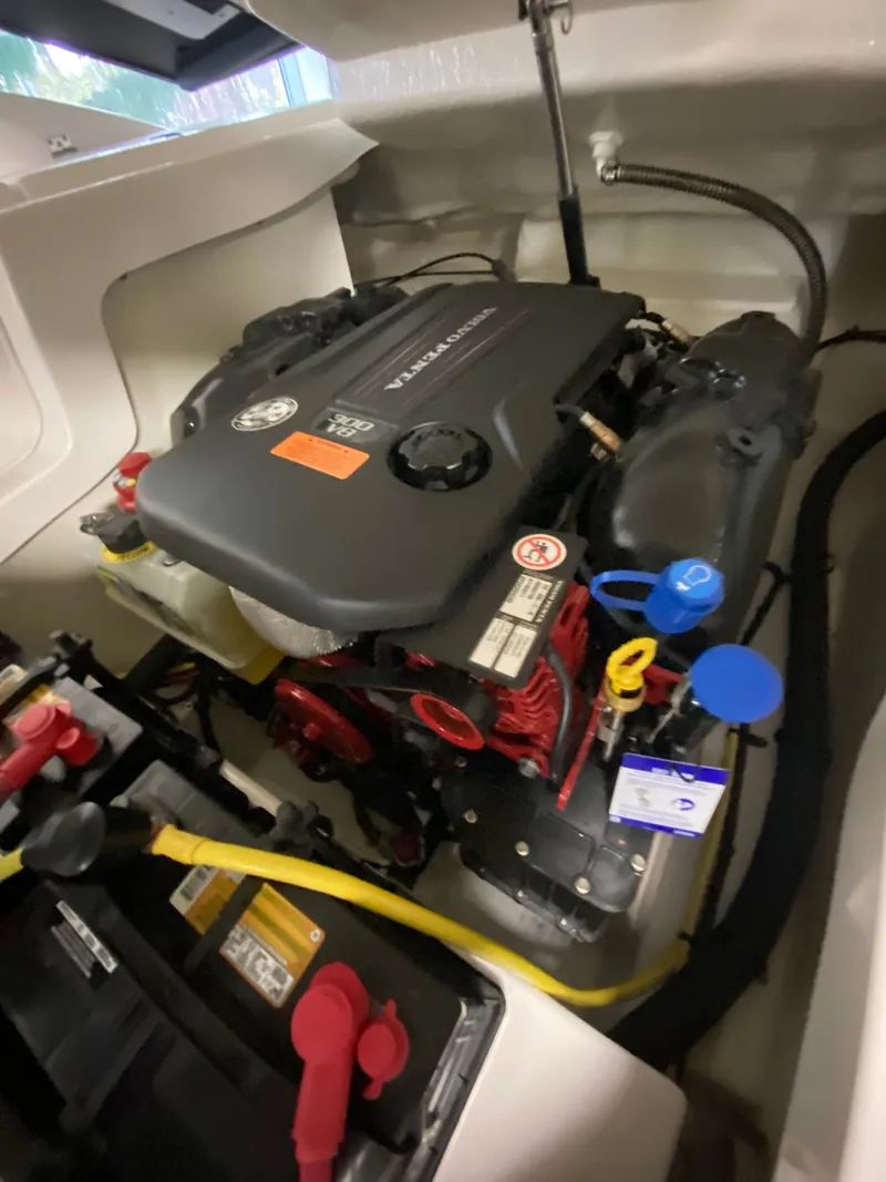 Slide: The Image of Engine compartment of a 2020 Chaparral 24 SSI boat with visible engine. - 30