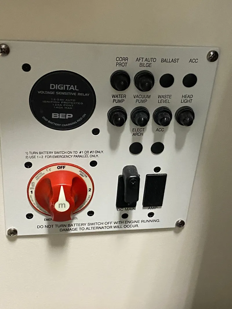 Slide: The Image of Control panel with various switches and indicators for boat systems. - 35