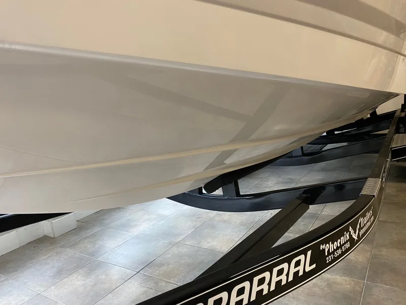 Slide: The Image of Chaparral 24 SSI from 2020 on a trailer in a showroom. - 11