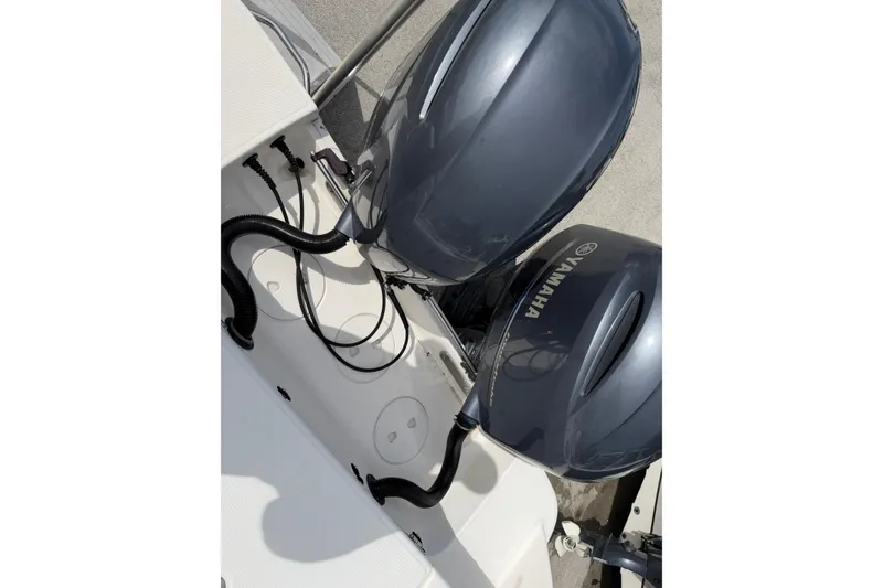Slide: The Image of 2017 Robalo R242 Center Console with dual Yamaha outboard motors. - 61
