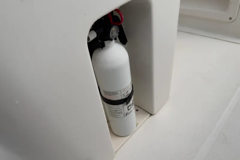 Slide: The Image of Fire extinguisher on 2017 Robalo R242 Center Console boat. - 67