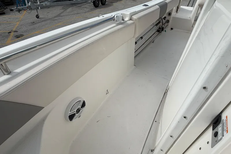 Slide: The Image of 2017 Robalo R242 Center Console boat interior with seating and speaker. - 64