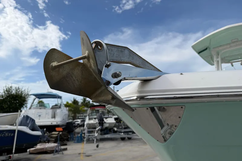 Slide: The Image of 2017 Robalo R242 Center Console boat anchor detail under a clear blue sky. - 3