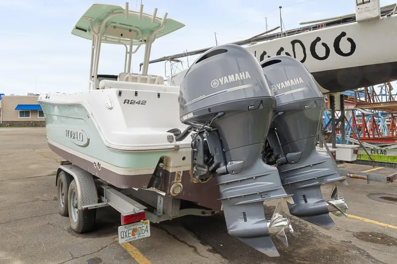 Slide: The Image of 2017 Robalo R242 Center Console boat with twin Yamaha outboard engines on a trailer. - 39