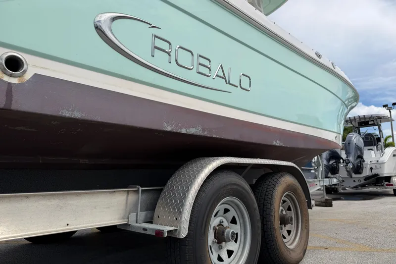 Slide: The Image of 2017 Robalo R242 Center Console boat on trailer, close-up view. - 45