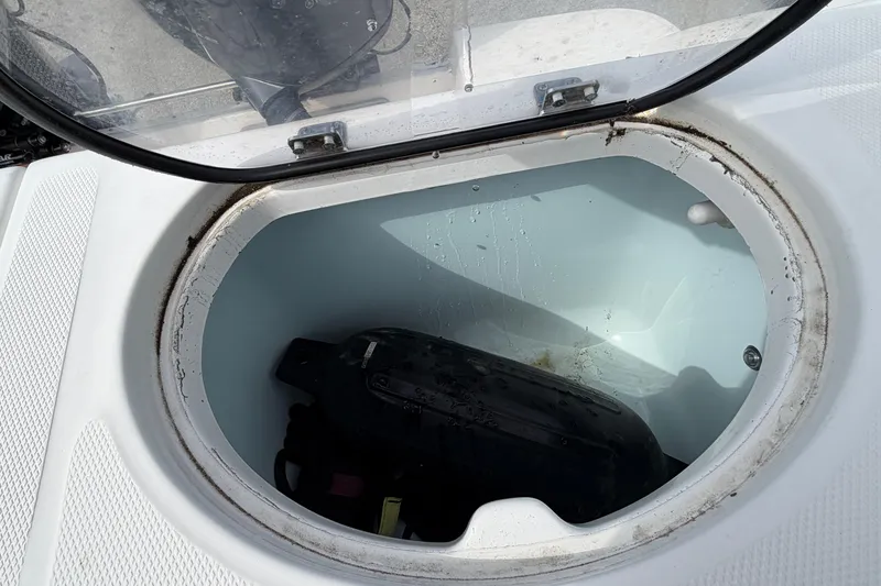 Slide: The Image of Open storage compartment on 2017 Robalo R242 Center Console boat. - 51