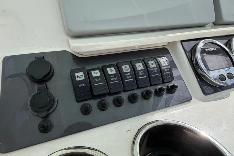 Slide: The Image of Control panel of a 2017 Robalo R242 Center Console boat with Yamaha gauges. - 18