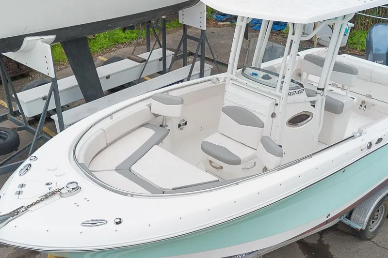 Slide: The Image of 2017 Robalo R242 Center Console boat with spacious seating and sleek design. - 7