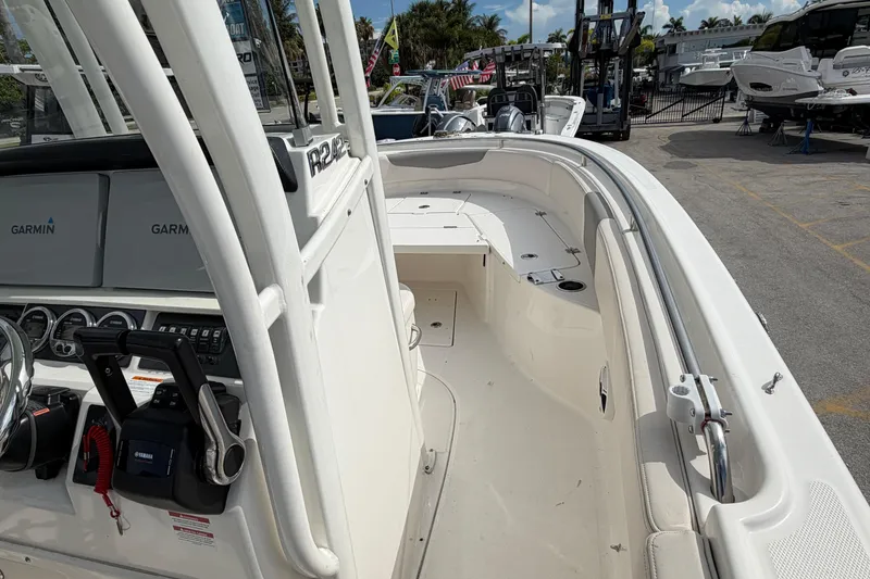 Slide: The Image of 2017 Robalo R242 Center Console boat interior with Garmin electronics and Yamaha controls. - 25