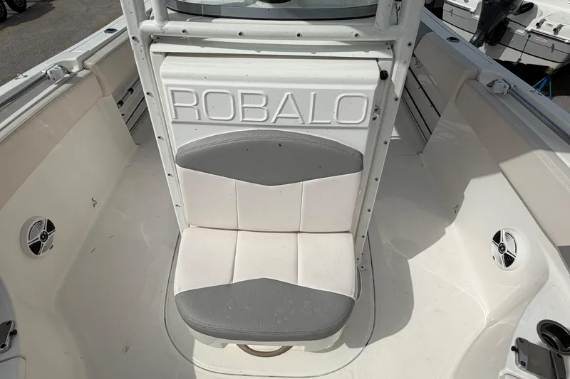 Slide: The Image of 2017 Robalo R242 Center Console boat interior with seating and speakers. - 33