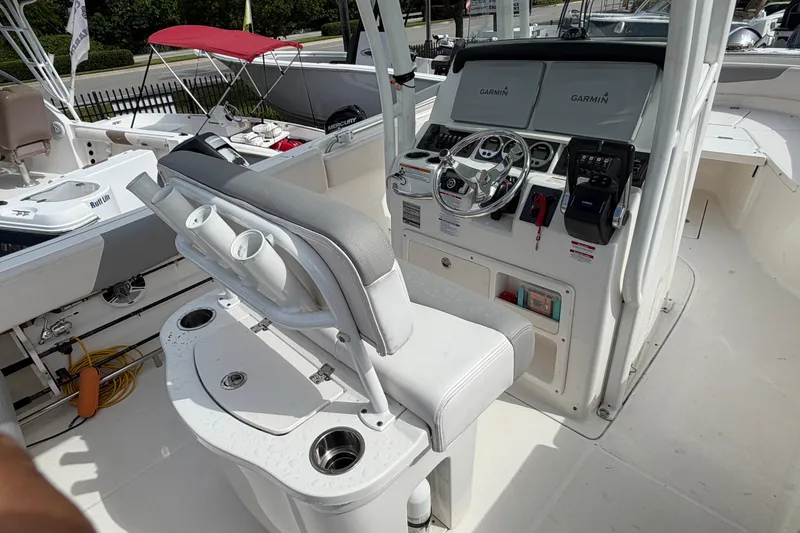 Slide: The Image of 2017 Robalo R242 Center Console boat interior with Garmin navigation system and seating. - 28
