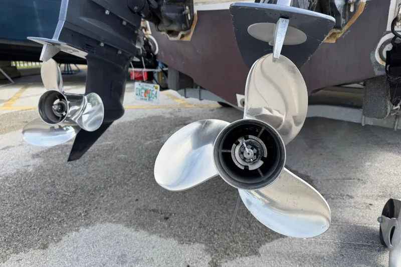 Slide: The Image of Twin propellers of a 2017 Robalo R242 Center Console boat on display. - 13