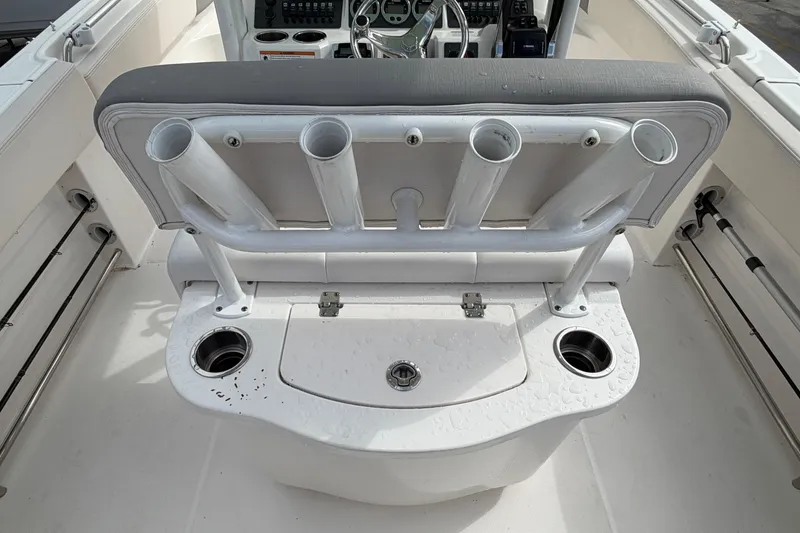 Slide: The Image of 2017 Robalo R242 Center Console boat with rod holders and storage compartment. - 30